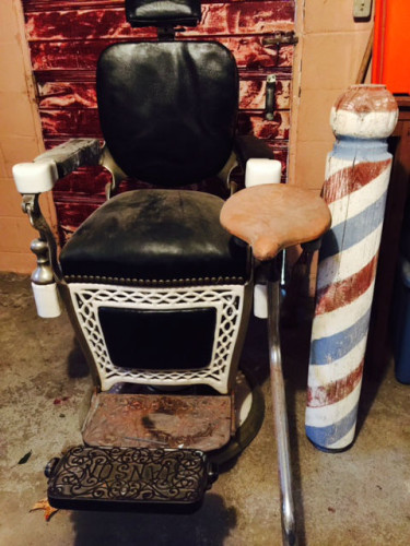 Barber chair with wooden barber pole